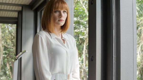 Claire_standing_in_glass_hallway_above_paddock.jpg